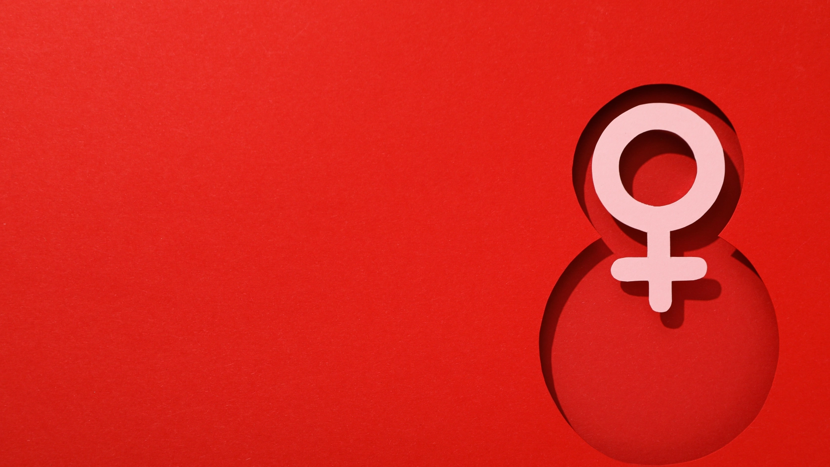 Number eight cut out of paper on a red background