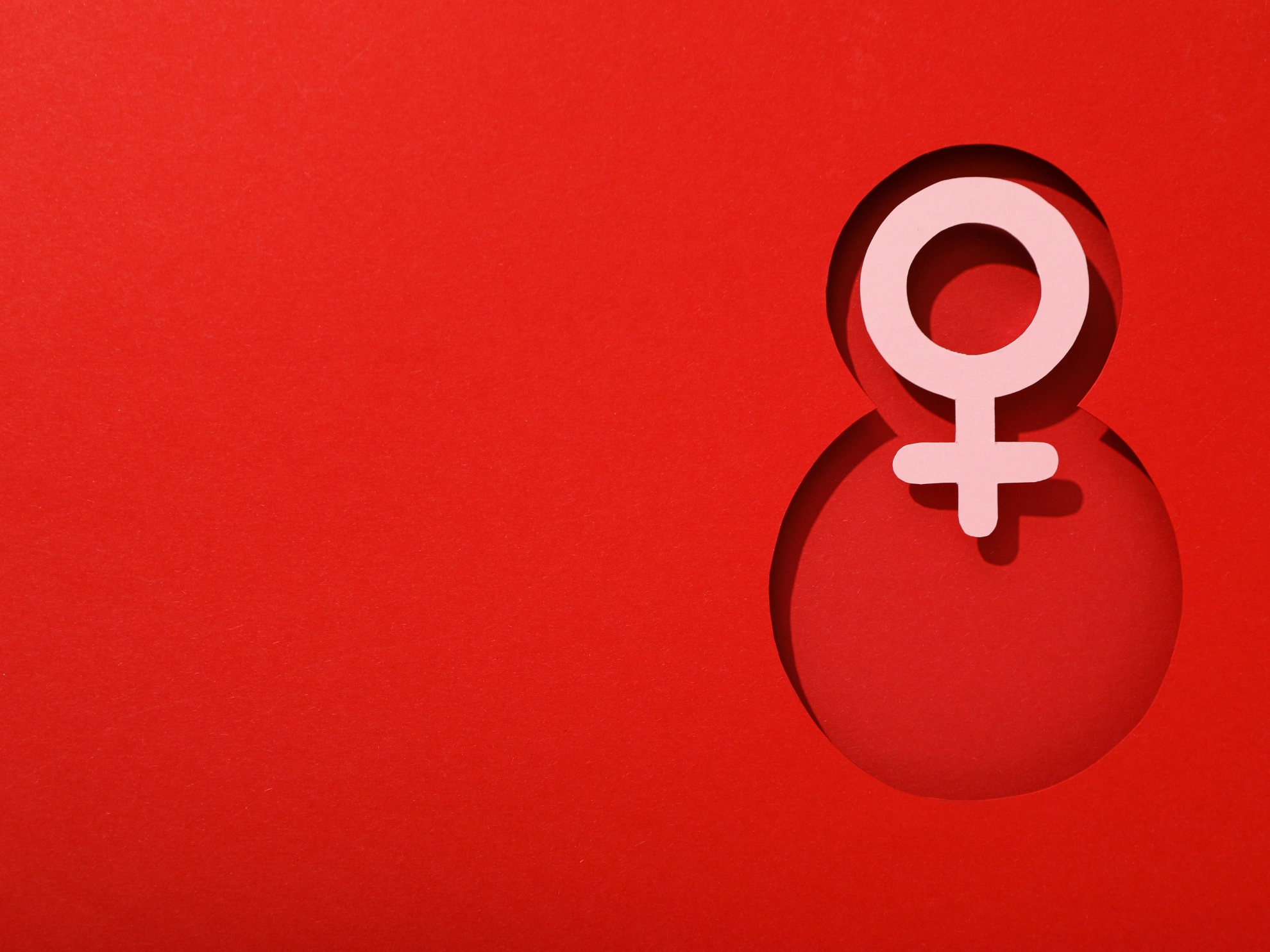 Number eight cut out of paper on a red background